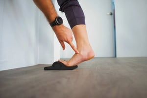 Podiatry assessment inner ankle pointing