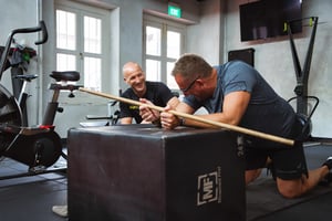 Personal trainer with client in the UFIT Gym