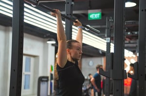Woman lifting Barbell